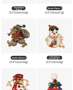 Detailed view of Christmas brooches with enamel finish and colorful rhinestones