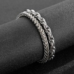 Close-up of dual-layer silver stainless steel wheat chain and rope chain set for men