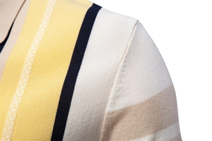 Close-up of the shoulder stitching and textured striped knit fabric of this men's polo shirt