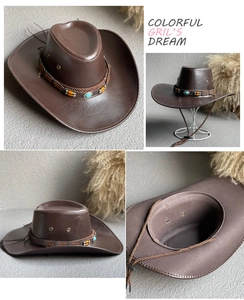 Detail view of dark brown western cowboy hat with ethnic beaded turquoise band decoration