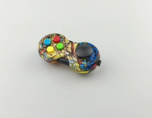 Close-up of graffiti pattern sensory fidget pad with joystick and colorful buttons