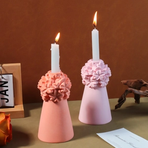 Detailed relief flower patterns on matte coral and pink silicone candle holders