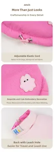 Pink corduroy dog vest detail featuring adjustable drawstrings and harness D-ring hole