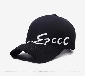 Close-up of vintage distressed black baseball cap with white 3D letter embroidery