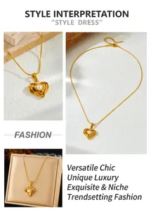 Detail of gold-plated irregular heart pendant with white pearl on a snake chain