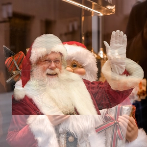 Detail of perforated PVC car window sticker featuring a vivid Santa Claus design