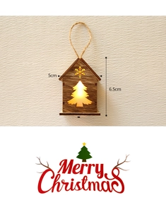 Detailed view of 6.5cm wooden glowing Christmas house ornament with warm LED light
