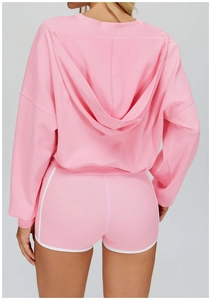 Rear view of a pink hooded sports set with premium cotton texture and white piping details