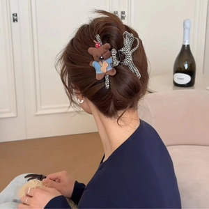 Cute brown plush dog with black and white plaid bow hair claw clip for bun hairstyles