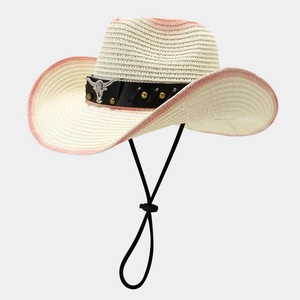 Detail of western straw hat with black leather band, silver bull head logo and gold rivets