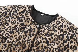 Close-up of leopard print quilted jacket featuring snap buttons and round neckline