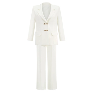 Detail of white double-breasted blazer with golden buttons and matching trousers