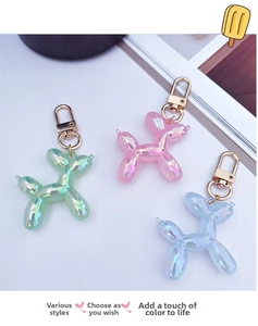 Colorful resin balloon dog keychains with gradient pearl finish and golden snap hooks