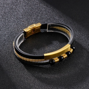 Detail of multi-layer braided leather bracelet with stainless steel beads and mesh band