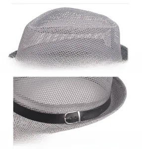 Macro detail of the breathable grey mesh fabric and black decorative belt with metal buckle
