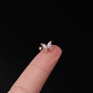 Macro shot of rose gold butterfly ear stud with marquise cubic zirconia and ball back