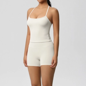 Close-up of white high-elastic racerback yoga tank top and high-waist sports shorts