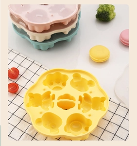 Colorful cat claw silicone baby food molds for steaming with various pastel colors shown