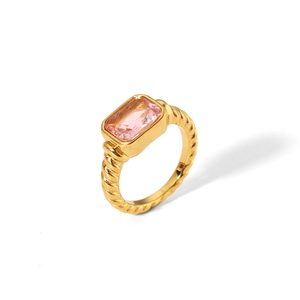 Detail of 18K gold twist band ring featuring a rectangular pink zircon stone setting