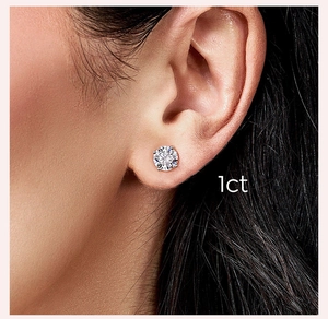Macro side view of 1ct Moissanite stud earring with classic four-prong setting on ear