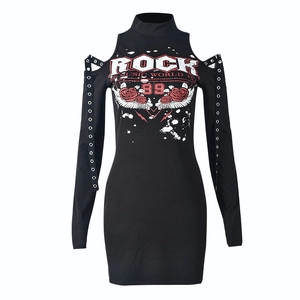 Detail of cold shoulder cutout with metal eyelets and rock graphic on black mini dress