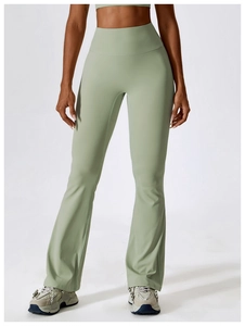 Detail of high-waisted mint green flare yoga pants with seamless stretch fabric