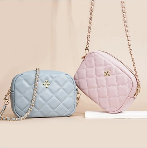 Quilted leather crossbody phone bags in blue and pink with elegant gold floral hardware