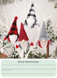 Close-up of four hanging Christmas gnome ornaments with plaid hats on white branches