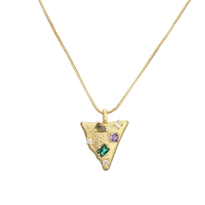 Detail of gold heart necklace with colorful square and round gemstones on box chain