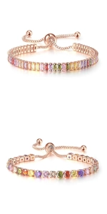 Detail of rose gold rainbow tennis bracelets with round and baguette cut crystals