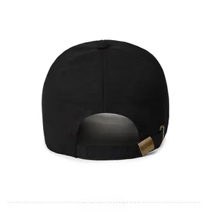 Detail of adjustable metal buckle and cotton twill back on the black baseball cap