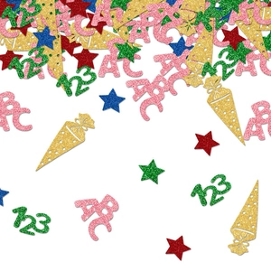 Close-up of glittery ABC letters, numbers, and stars for school party table confetti