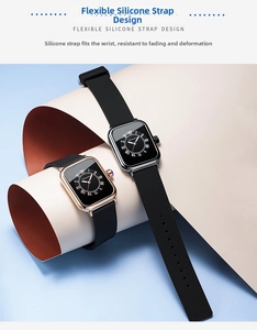 Close-up of stylish analog quartz watches with silicone bands in rose gold and silver