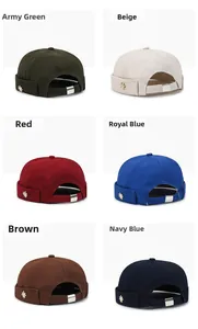 Detail showing various colors of cotton brimless dock caps with metallic leaf accents