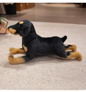 Detailed close-up of a realistic plush puppy toy in a lying position on a soft rug