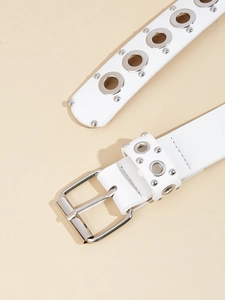 Close-up of white punk style belt featuring metal eyelets and square buckle detail