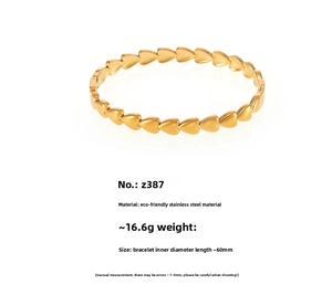 Macro shot of 18K gold plated stainless steel heart link bracelet with 60mm inner diameter
