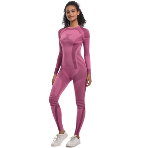 Detail of seamless compression yoga set featuring X-pattern jacquard and striped texture