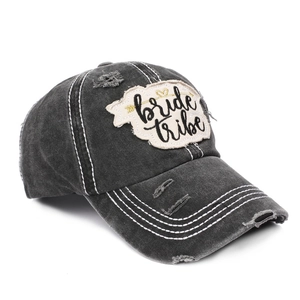 Close-up of distressed washed cotton baseball cap with Bride Tribe heart embroidery