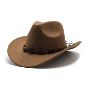 Classic brown western cowboy felt hat with beaded band and decorative vintage buckle