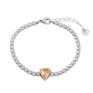 Detail of silver steel bracelet with white zircons and a yellow heart-shaped gem center