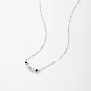 Macro shot of silver S925 necklace featuring five multi-colored curved gemstones