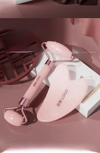 Pink stone facial roller and heart shaped gua sha set in a minimalist white gift box