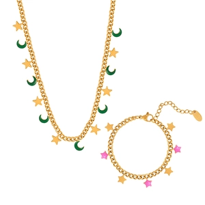 Elegant gold celestial jewelry set featuring star and moon charms on necklace and bracelet