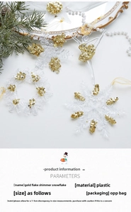 Detail of acrylic snowflake and ballerina ornaments with gold glitter and ribbons