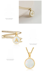Macro shot of gold-plated titanium necklace with white shell inlay and letter pendant