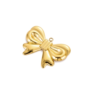 Detail of gold plated stainless steel bow pendant with high polish mirror finish