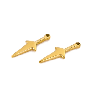 Macro view of two golden stainless steel kunai charms for jewelry making DIY