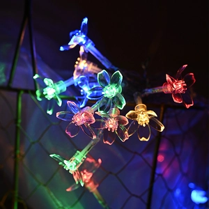 Multi-colored LED cherry blossom string lights hanging on wire for festive home decoration