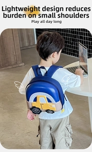 Detail of blue toddler backpack with 3D yellow car design and padded shoulder straps